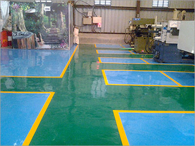Image of an industrial shop with an epoxy floor coating installed.